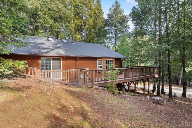 rear view of house with a deck