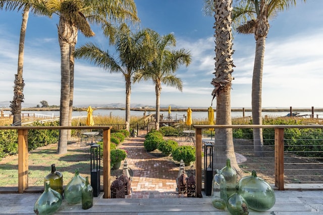 wooden terrace with a water view