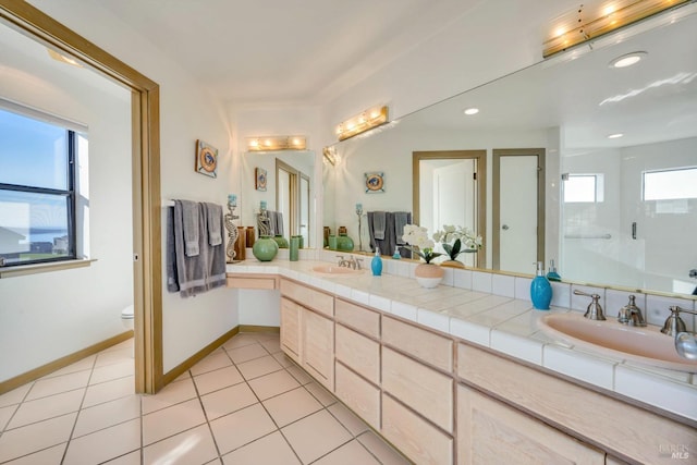 bathroom with tile patterned floors, vanity, toilet, and walk in shower