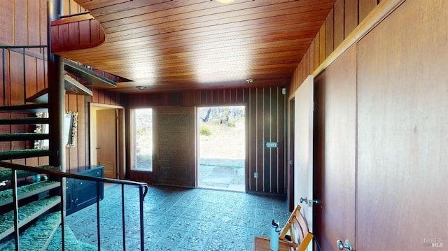 interior space with wooden ceiling and wooden walls