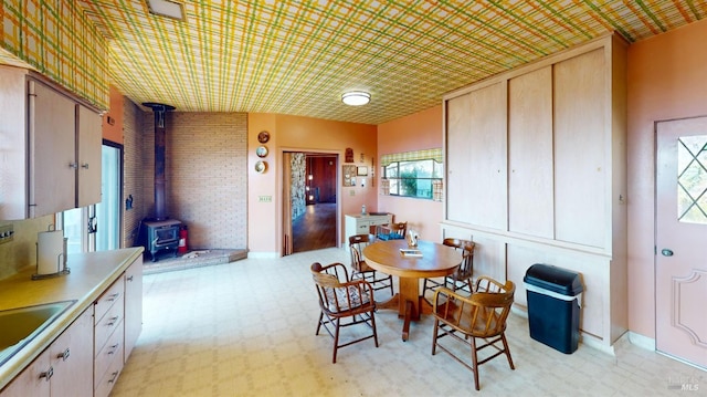 dining space featuring a wood stove