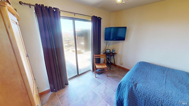 tiled bedroom featuring access to outside