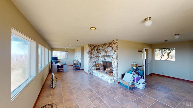 interior space with a fireplace and tile patterned floors