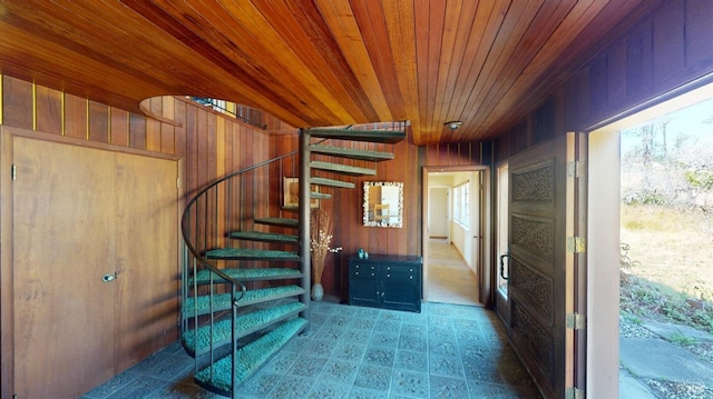 interior space with wood ceiling and wooden walls