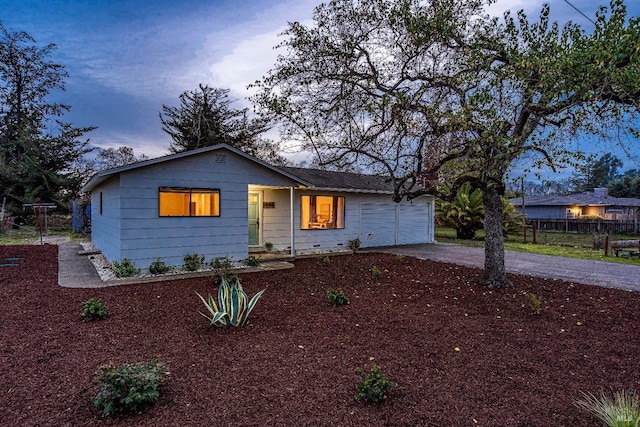 ranch-style home featuring a garage