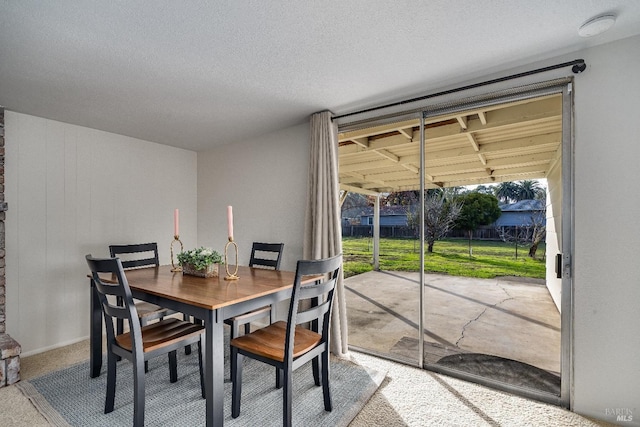 dining area with a textured ceiling