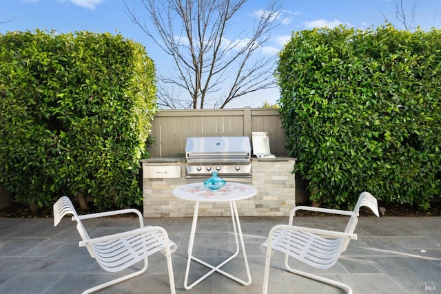 view of patio with area for grilling and grilling area