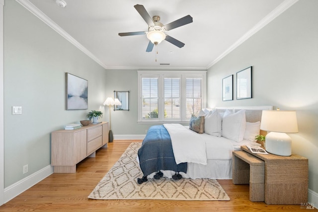 bedroom with ornamental molding, light hardwood / wood-style floors, and ceiling fan