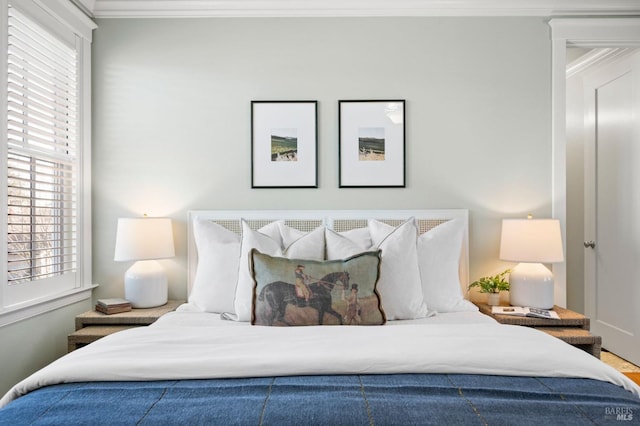 bedroom featuring crown molding