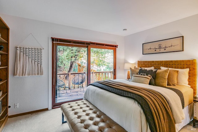 bedroom featuring light carpet, baseboards, and access to outside