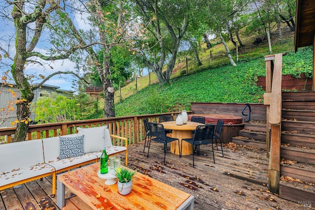 wooden deck with outdoor dining area and outdoor lounge area