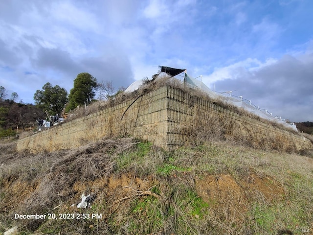 view of home's exterior with a rural view