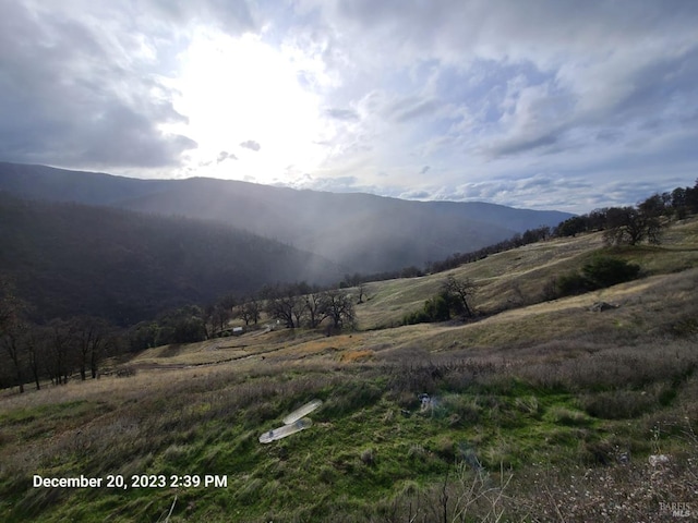 property view of mountains featuring a rural view