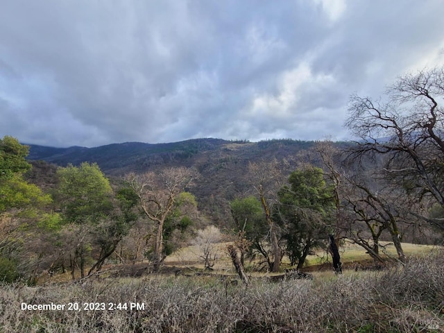 view of mountain feature with a rural view