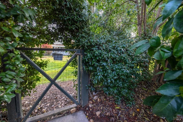 view of gate featuring fence