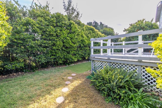 view of yard with a wooden deck