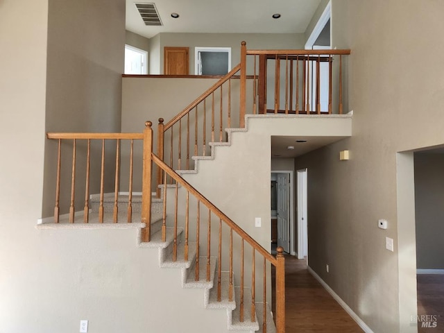 staircase featuring hardwood / wood-style floors