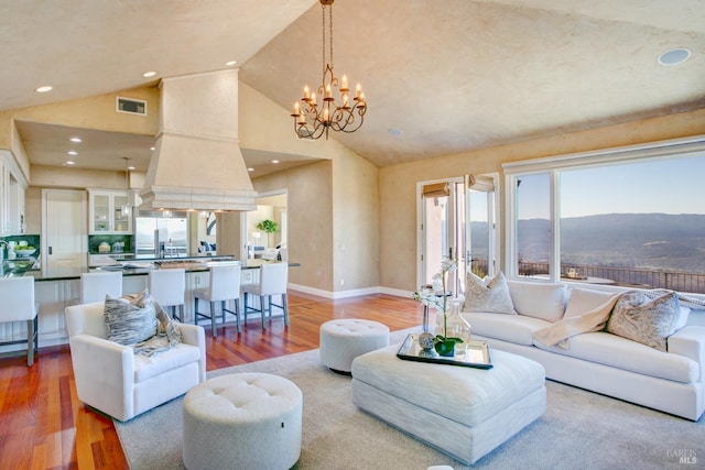 living room with a chandelier, recessed lighting, visible vents, and light wood-style flooring