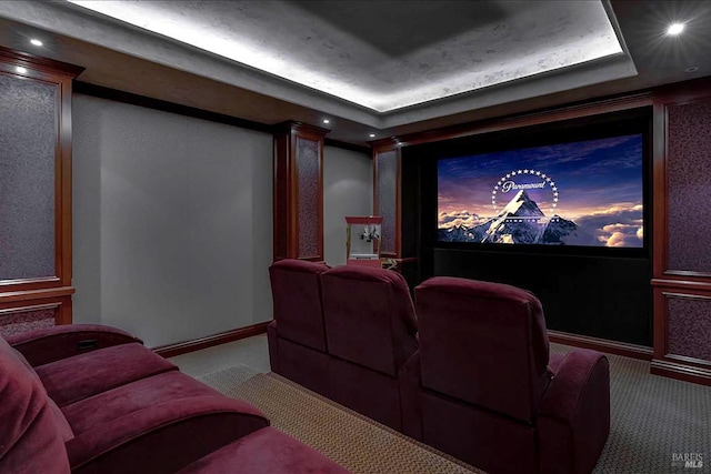 carpeted home theater featuring baseboards, a raised ceiling, and recessed lighting