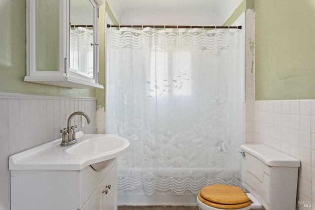 full bathroom featuring vanity, shower / bath combination with curtain, and toilet