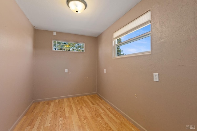 unfurnished room featuring light hardwood / wood-style flooring