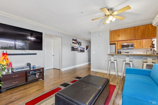 living room featuring crown molding, ceiling fan, and light wood-type flooring