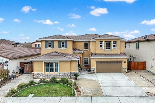 view of front of home featuring a garage and a front yard