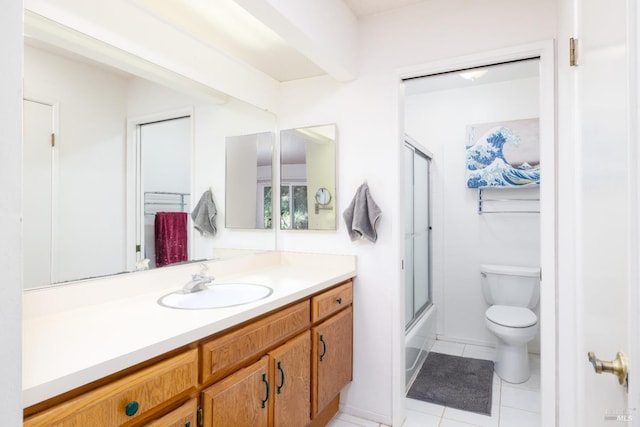 full bathroom with tile patterned flooring, vanity, toilet, and shower / bath combination with glass door