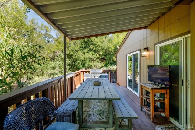 wooden deck with grilling area