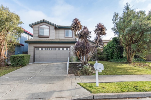 view of front property featuring a front yard and a garage