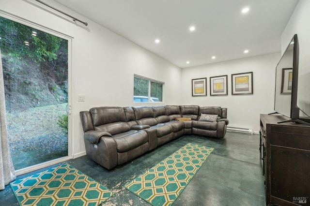 living room featuring finished concrete flooring, a baseboard radiator, and recessed lighting