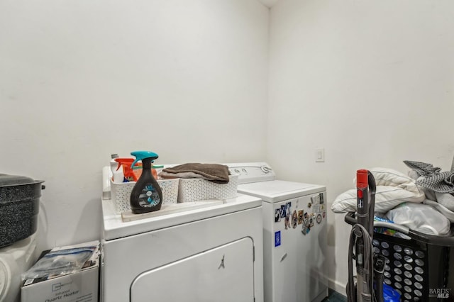 clothes washing area with laundry area and separate washer and dryer