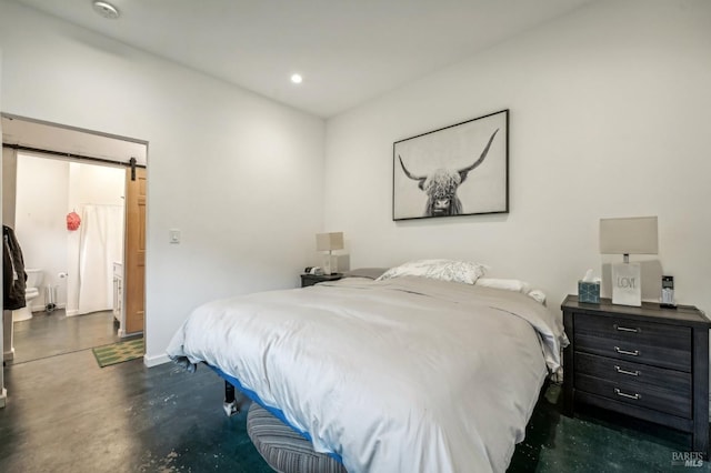 bedroom with concrete flooring, recessed lighting, baseboards, and a barn door