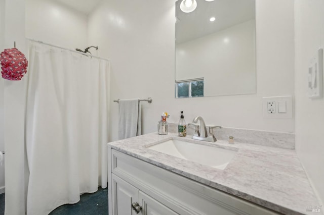 full bathroom featuring recessed lighting and vanity