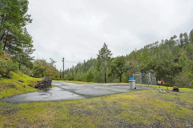 view of road featuring a view of trees