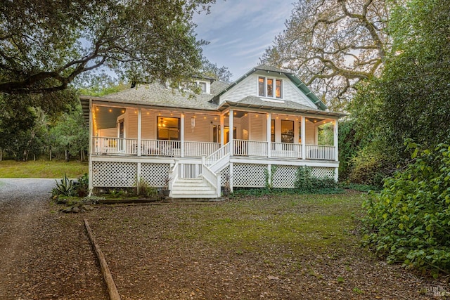 country-style home featuring a porch