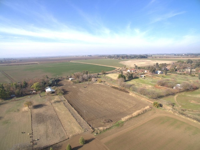 birds eye view of property with a rural view