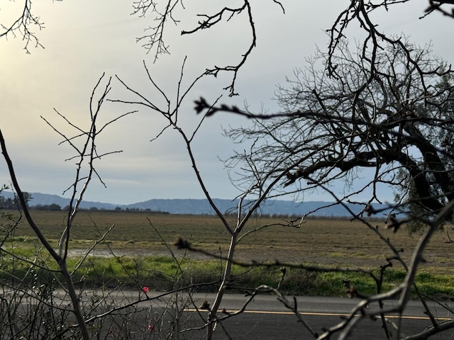 property view of mountains featuring a rural view