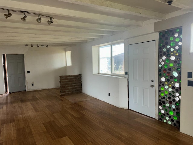 entryway featuring dark wood-type flooring and beamed ceiling