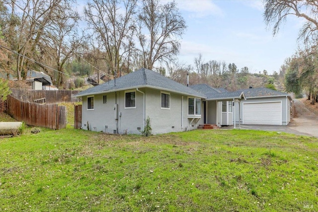 single story home featuring a front yard and a garage