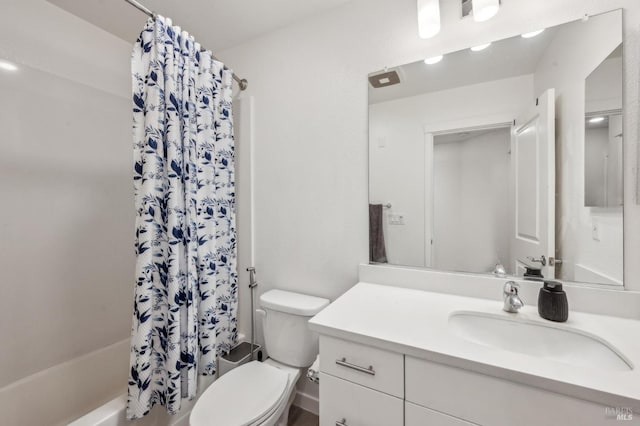 full bathroom with vanity, shower / bath combination with curtain, and toilet