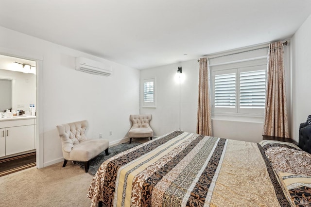 carpeted bedroom featuring ensuite bath, multiple windows, and a wall mounted air conditioner