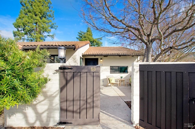 view of gate featuring a fenced front yard