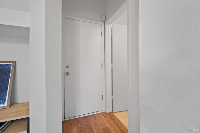 corridor with light wood-type flooring