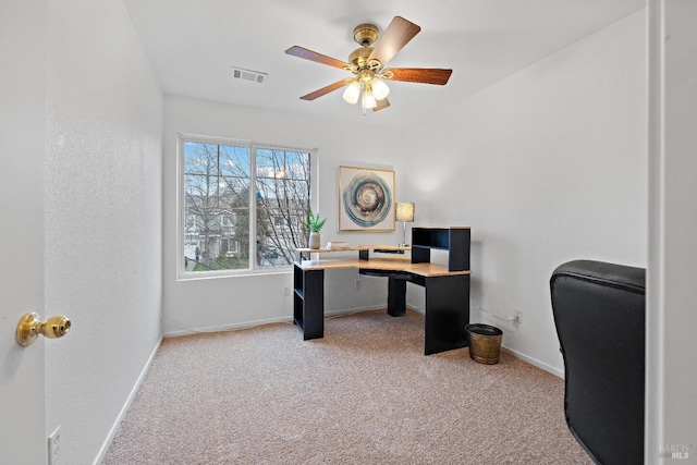 office space with carpet floors and ceiling fan