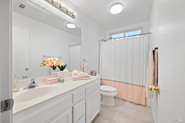 bathroom with vanity, toilet, and walk in shower