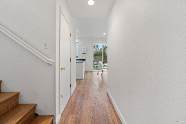 corridor featuring hardwood / wood-style floors