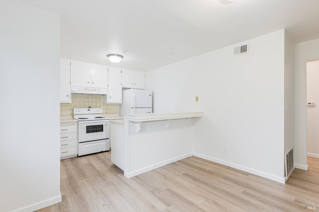 kitchen with white cabinets, white appliances, premium range hood, and light hardwood / wood-style floors