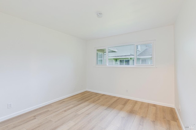 spare room featuring light hardwood / wood-style flooring