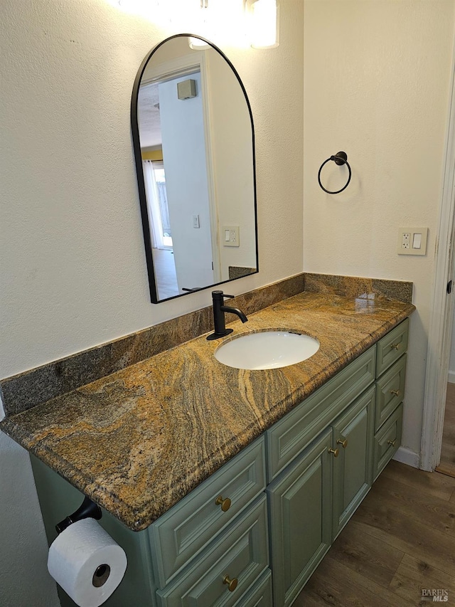 bathroom featuring hardwood / wood-style floors and vanity